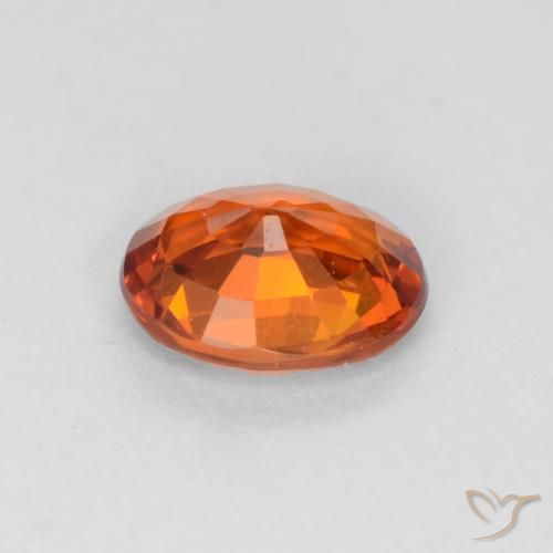 Zafiro Naranja oscuro natural de 0.58 ct, Ovalada, VVS-VS