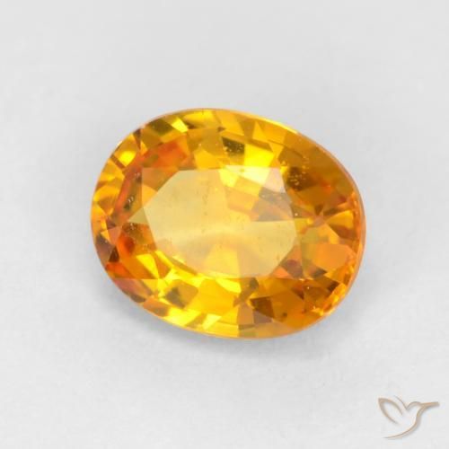 Zafiro Dorado naranja intenso natural de 0.59 ct, Ovalada, VVS-VS