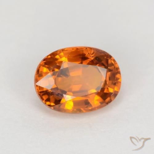 Zafiro Naranja oscuro medio natural de 0.72 ct, Ovalada, VVS-VS