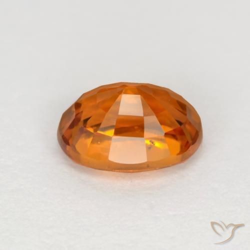 Zafiro Naranja oscuro medio natural de 0.72 ct, Ovalada, VVS-VS