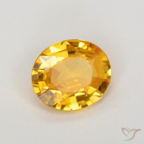 Zafiro Dorado medio natural de 0.64 ct, Ovalada, VVS-VS