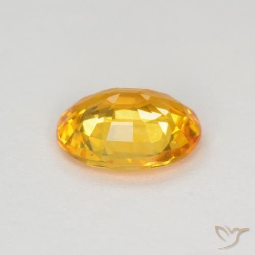 Zafiro Dorado medio natural de 0.64 ct, Ovalada, VVS-VS