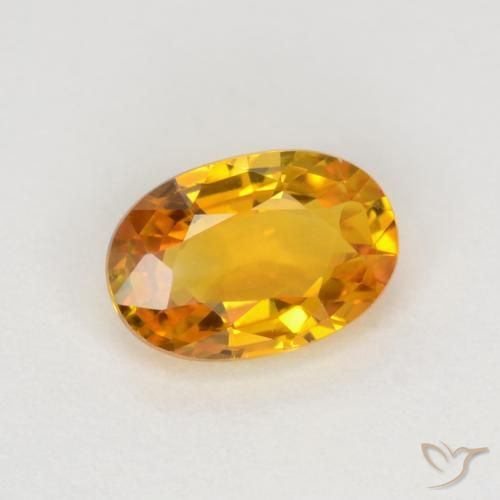 Zafiro Dorado naranja intenso natural de 0.72 ct, Ovalada, VVS-VS
