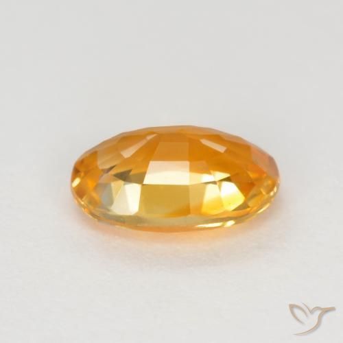 Zafiro Dorado naranja intenso natural de 0.72 ct, Ovalada, VVS-VS