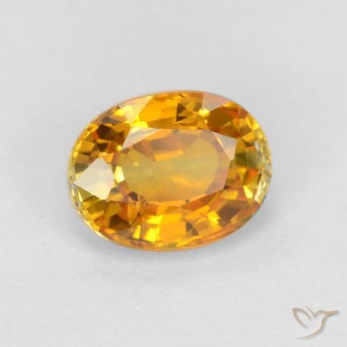 Zafiro Dorado naranja oscuro natural de 0.72 ct, Ovalada, VS