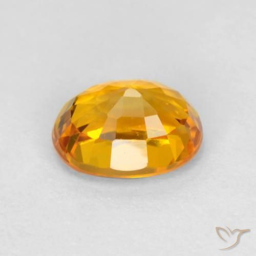 Zafiro Dorado naranja oscuro natural de 0.72 ct, Ovalada, VS