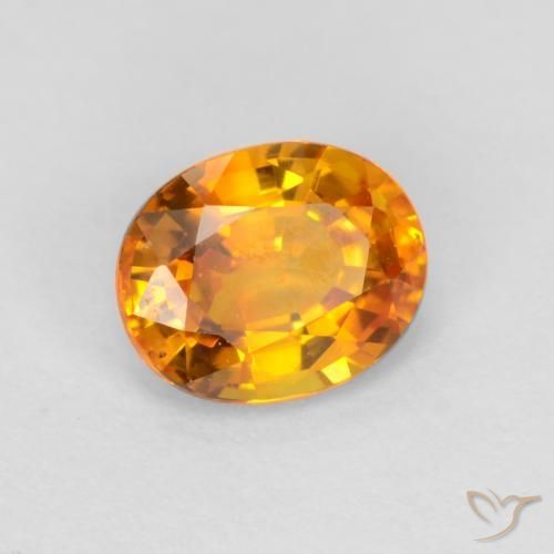 Zafiro Dorado naranja oscuro natural de 0.72 ct, Ovalada, VVS-VS