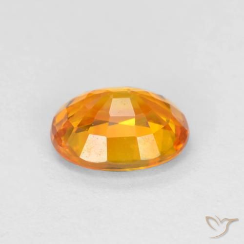 Zafiro Dorado naranja oscuro natural de 0.72 ct, Ovalada, VVS-VS