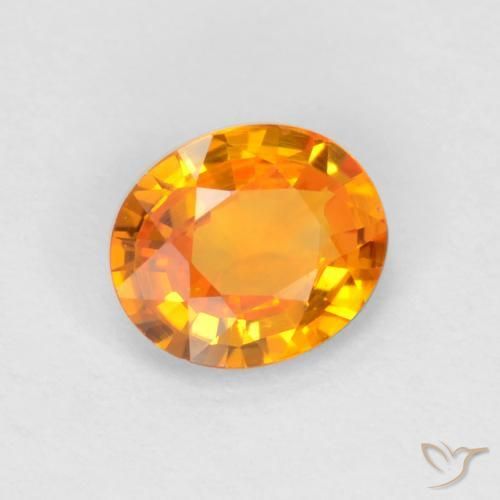 Zafiro Naranja oscuro natural de 0.49 ct, Ovalada, VVS-VS