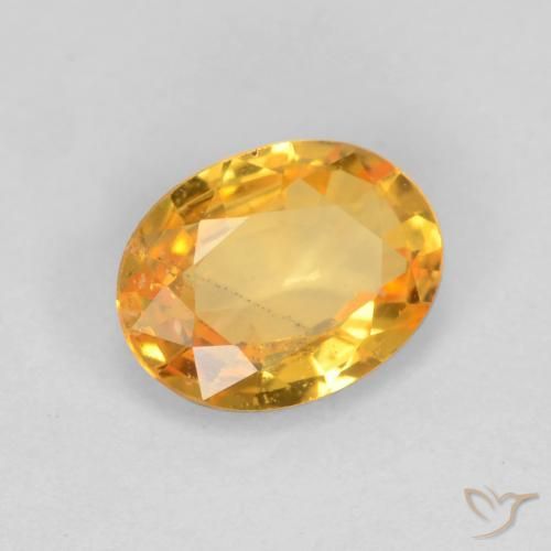 Zafiro Dorado naranja claro medio natural de 0.78 ct, Ovalada, VS