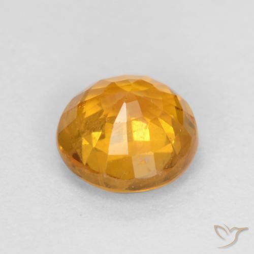 Zafiro Dorado naranja oscuro natural de 0.60 ct, Redondo, VS