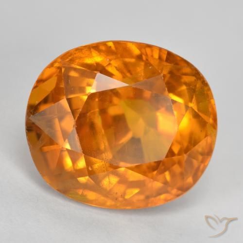 Zafiro Ámbar naranja natural de 6.87 ct, Ovalada, VS-SI