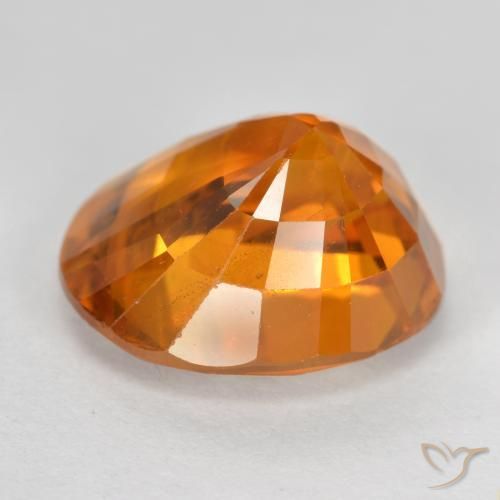 Zafiro Ámbar naranja natural de 6.87 ct, Ovalada, VS-SI