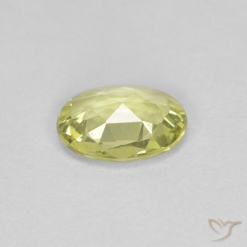 Zafiro Amarillo verdoso claro natural de 0.66 ct, Ovalada, VS