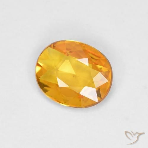 Zafiro Dorado naranja oscuro natural de 0.58 ct, Ovalada, VVS-VS