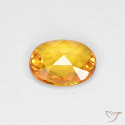 Zafiro Dorado naranja oscuro natural de 0.58 ct, Ovalada, VVS-VS