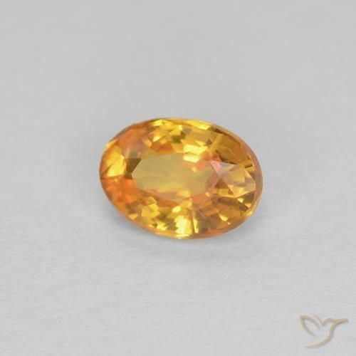 Zafiro Dorado naranja intenso natural de 0.44 ct, Ovalada, VVS