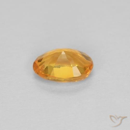 Zafiro Dorado naranja intenso natural de 0.44 ct, Ovalada, VVS
