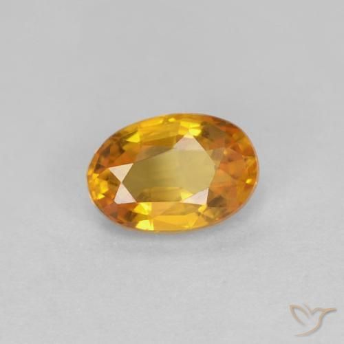 Zafiro Dorado naranja intenso natural de 0.56 ct, Ovalada, VVS-VS