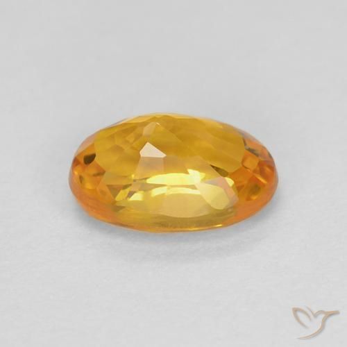 Zafiro Dorado-naranja medio natural de 0.70 ct, Ovalada, VS
