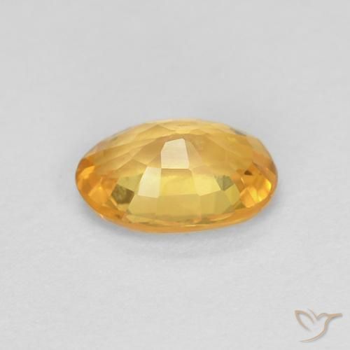 Zafiro Naranja dorado intenso natural de 0.56 ct, Ovalada, VS