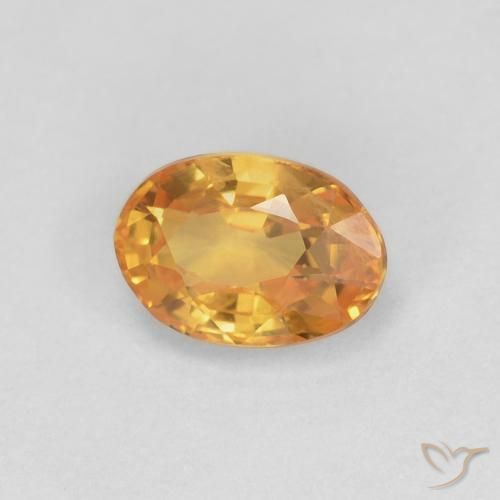 Zafiro Dorado naranja oscuro natural de 0.62 ct, Ovalada, VS
