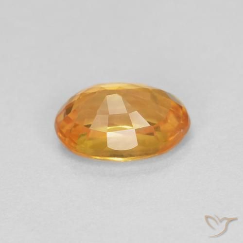 Zafiro Dorado naranja oscuro natural de 0.62 ct, Ovalada, VS