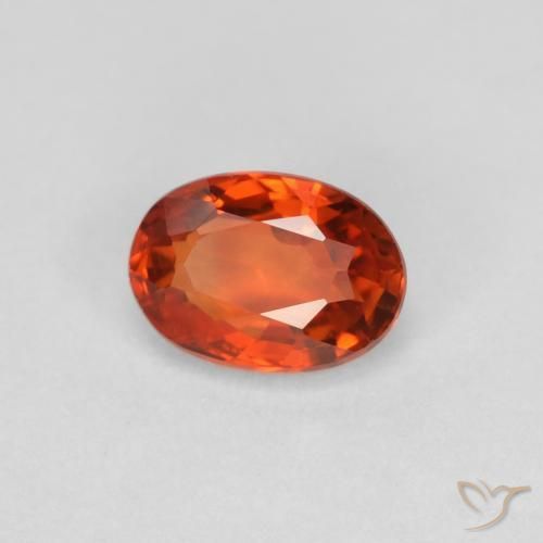 Zafiro Naranja rojizo natural de 0.64 ct, Ovalada, VVS