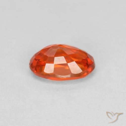 Zafiro Naranja rojizo natural de 0.64 ct, Ovalada, VVS