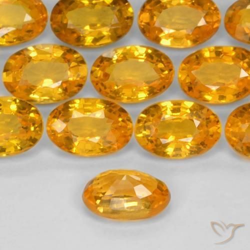 Zafiro Dorado naranja natural de 0.60 ct, Ovalada, VS