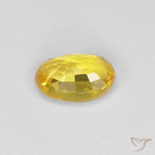 Zafiro Dorado natural de 0.49 ct, Ovalada, VVS