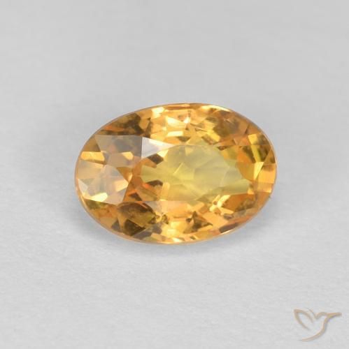 Zafiro Dorado naranja natural de 0.65 ct, Ovalada, VVS