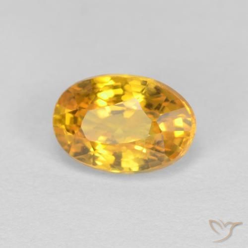 Zafiro Dorado oscuro natural de 0.70 ct, Ovalada, VVS
