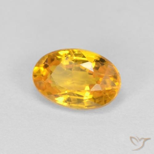Zafiro Naranja dorado natural de 0.66 ct, Ovalada, VVS