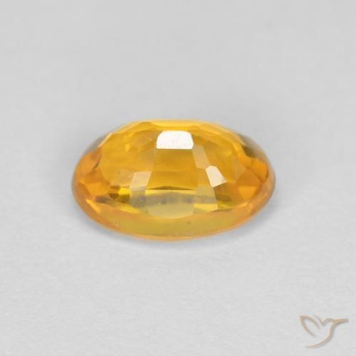 Zafiro Naranja dorado natural de 0.66 ct, Ovalada, VVS