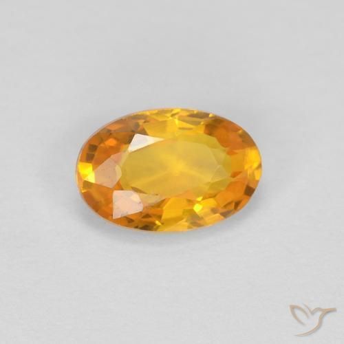 Zafiro Dorado naranja oscuro natural de 0.62 ct, Ovalada, VVS