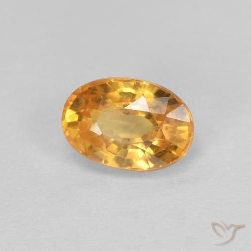 Zafiro Dorado naranja intenso natural de 0.75 ct, Ovalada, VVS