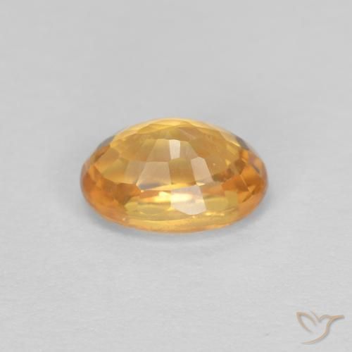 Zafiro Dorado naranja intenso natural de 0.75 ct, Ovalada, VVS