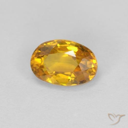 Zafiro Dorado oscuro natural de 0.71 ct, Ovalada, VVS