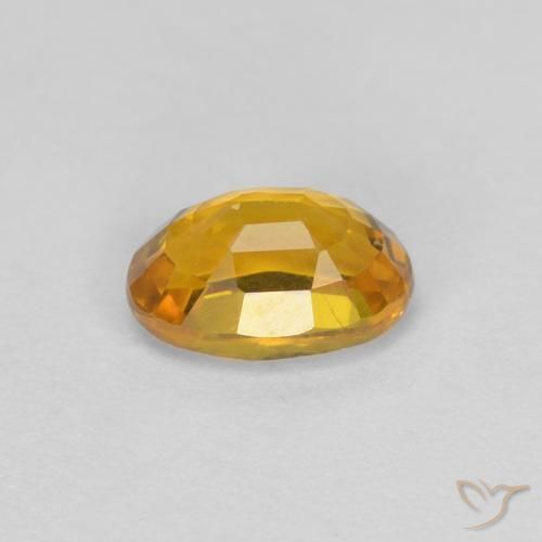 Zafiro Dorado oscuro natural de 0.71 ct, Ovalada, VVS