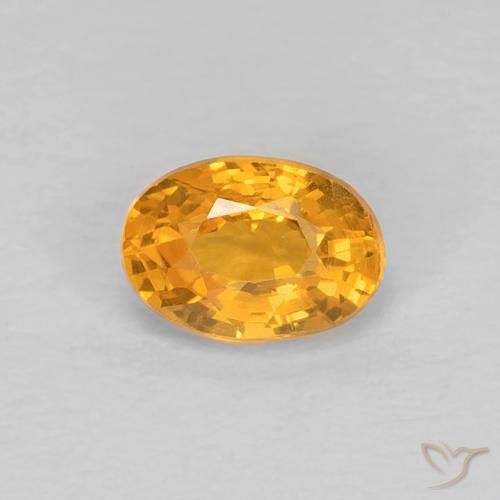 Zafiro Dorado naranja natural de 0.66 ct, Ovalada, VS