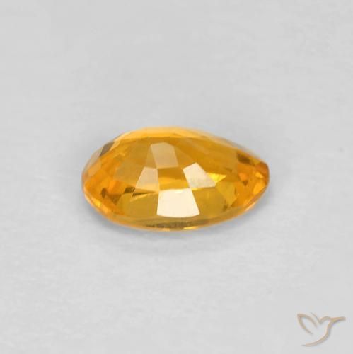 Zafiro Dorado naranja natural de 0.54 ct, Ovalada, VS