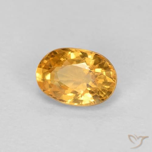 Zafiro Dorado naranja natural de 0.65 ct, Ovalada, VS