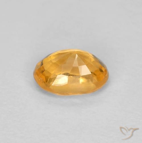 Zafiro Dorado naranja natural de 0.65 ct, Ovalada, VS