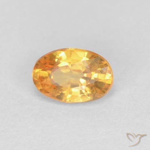 Zafiro Dorado naranja natural de 0.58 ct, Ovalada, VVS-VS