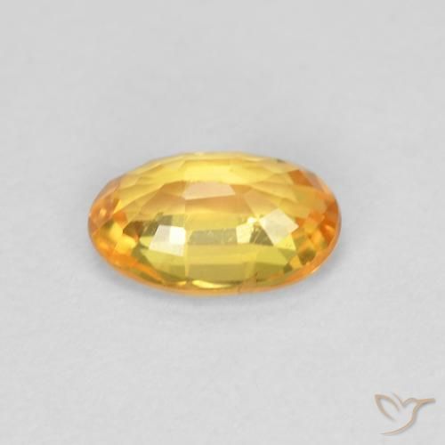 Zafiro Dorado naranja natural de 0.60 ct, Ovalada, VVS-VS