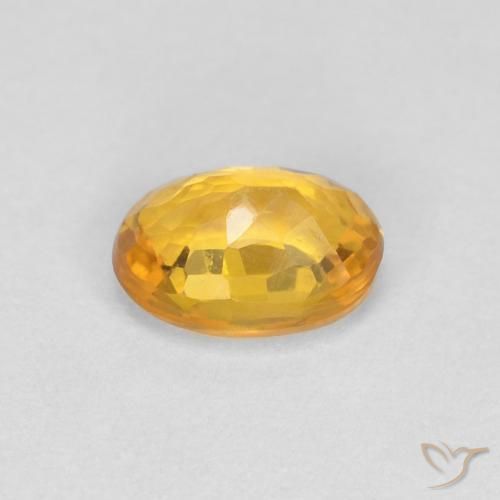 Zafiro Dorado naranja intenso natural de 0.65 ct, Ovalada, VVS