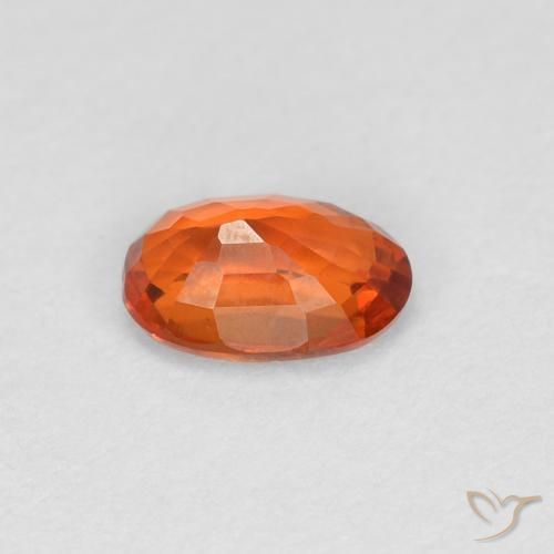 Zafiro Naranja rojizo natural de 0.56 ct, Ovalada, VVS