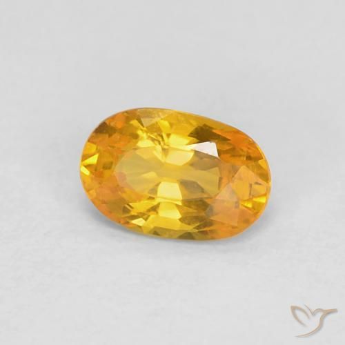 Zafiro Dorado naranja natural de 0.62 ct, Ovalada, VVS