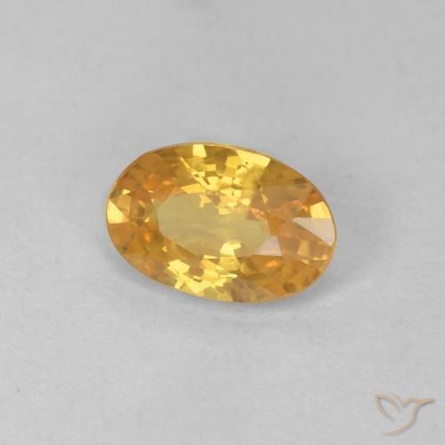 Zafiro Naranja dorado intenso natural de 0.57 ct, Ovalada, VS